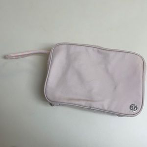 Lululemon Travel Bag in baby pink with silver hardware.